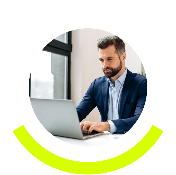 nicely dressed business man working on a laptop